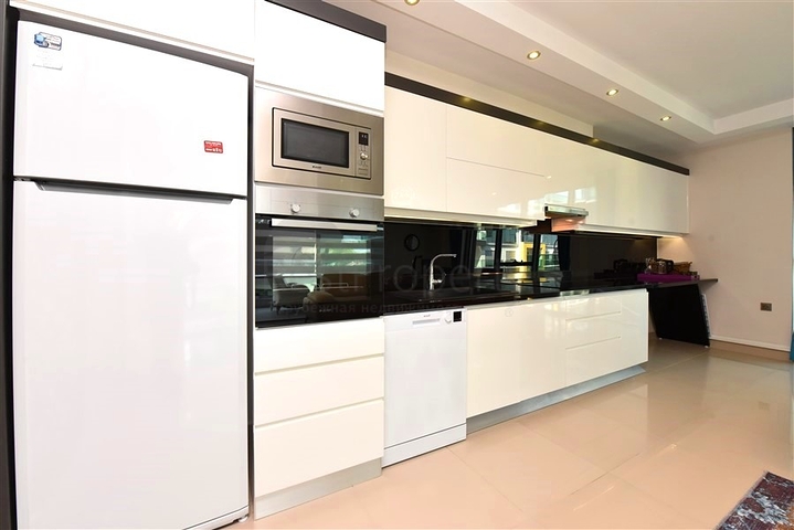 2+1 apartment in a respectable complex 50 meters from the beach in Kargicak district 