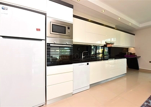 2+1 apartment in a respectable complex 50 meters from the beach in Kargicak district 