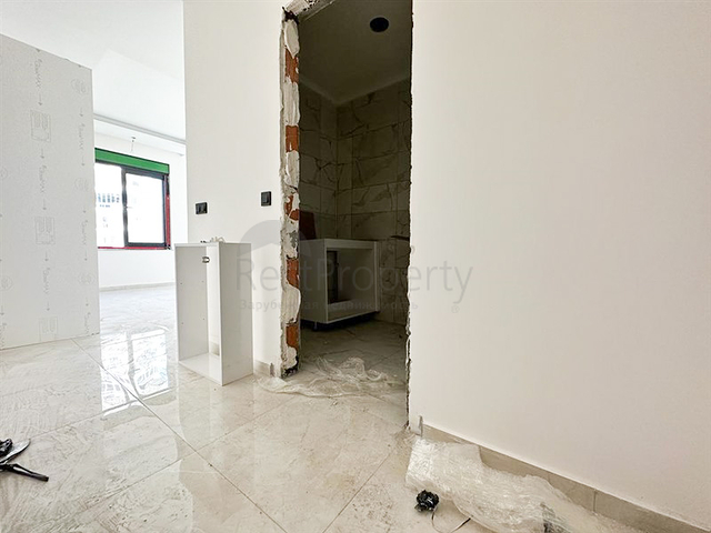 1+1 apartment in a building under construction in Mahmutlar district