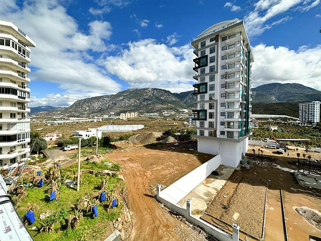 1+1 apartment in a building under construction in Mahmutlar district