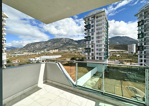 1+1 apartment in a building under construction in Mahmutlar district