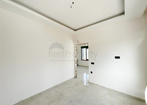 1+1 apartment in a building under construction in Mahmutlar district