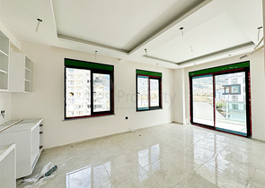 1+1 apartment in a building under construction in Mahmutlar district