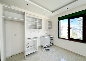 1+1 apartment in a building under construction in Mahmutlar district