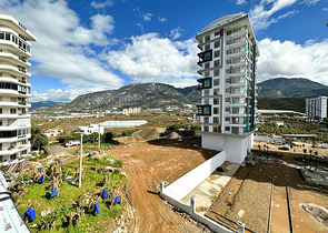 1+1 apartment in a building under construction in Mahmutlar district