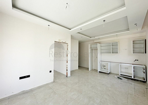 1+1 apartment in a building under construction in Mahmutlar district