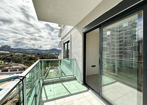 1+1 apartment in a building under construction in Mahmutlar district