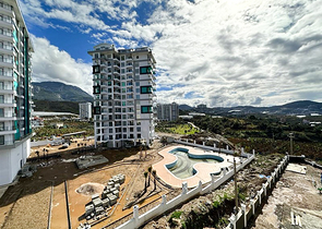 1+1 apartment in a building under construction in Mahmutlar district