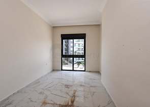 1+1 apartment in a new complex without infrastructure in Mahmutlar district