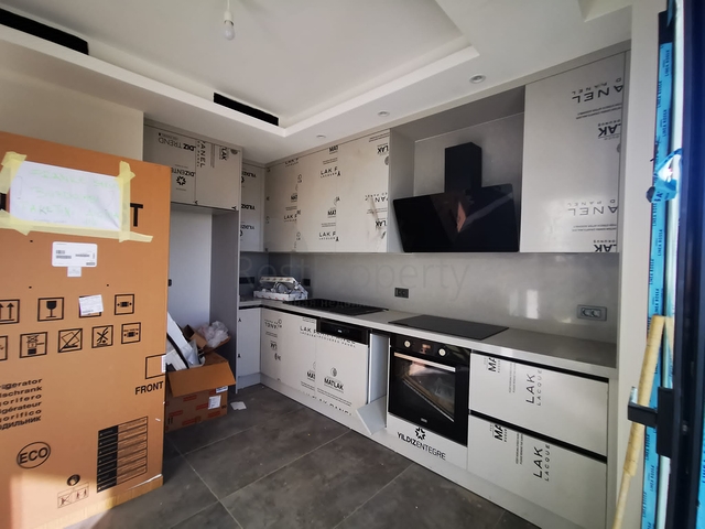 Villas in the picturesque area of Turkbukyu, surrounded by dense greenery. 