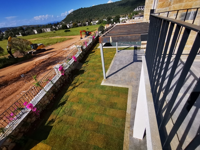 Villas in the picturesque area of Turkbukyu, surrounded by dense greenery. 