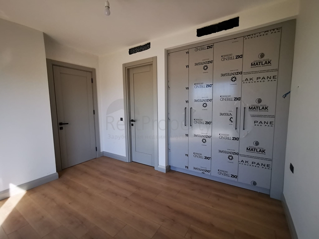 Villas in the picturesque area of Turkbukyu, surrounded by dense greenery. 