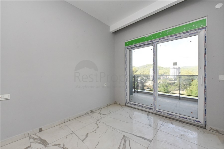 1+1 apartment in a new complex in Avsallar district