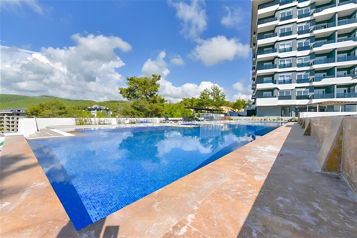 1+1 apartment in a new complex in Avsallar district