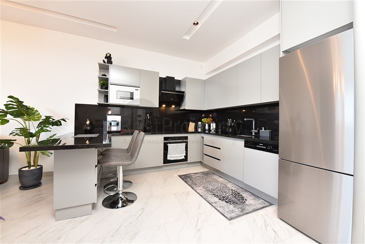 1+1 apartment with sea view in a new complex