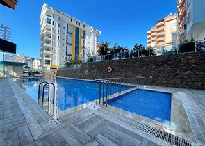 Spacious two-bedroom apartment within walking distance to the sea in the area of Tosmur open for residence permit