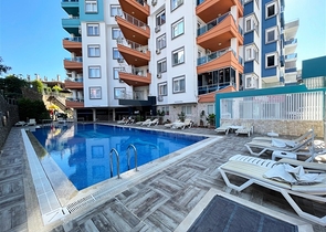 Spacious two-bedroom apartment within walking distance to the sea in the area of Tosmur open for residence permit