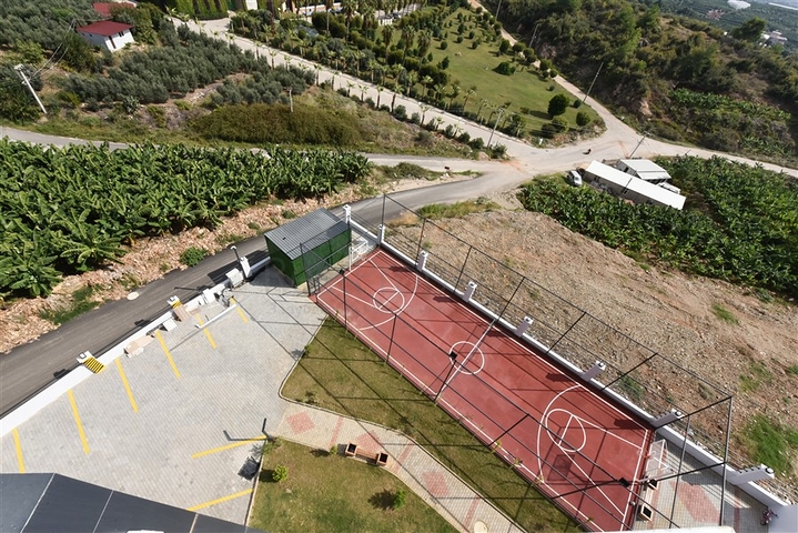 1+1 apartment with mountain and sea views in Mahmutlar district