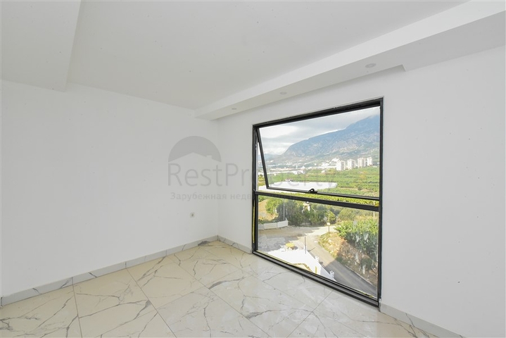 1+1 apartment with mountain and sea views in Mahmutlar district