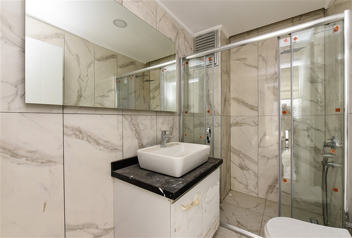 1+1 apartment with mountain and sea views in Mahmutlar district