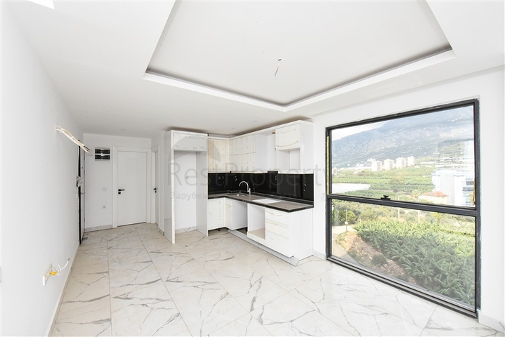 1+1 apartment with mountain and sea views in Mahmutlar district