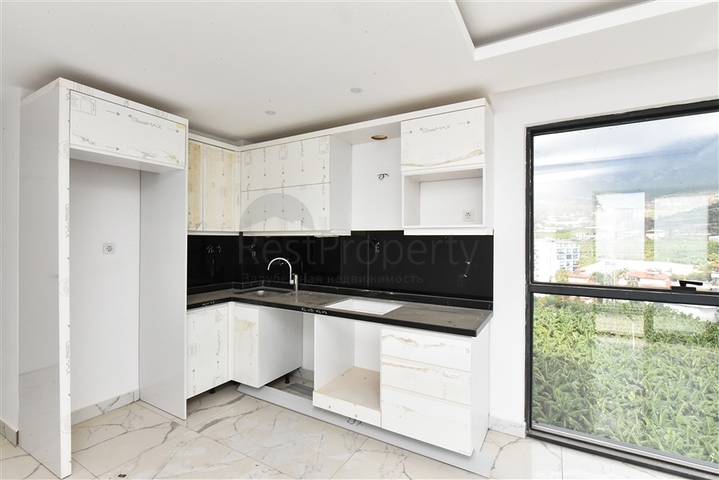 1+1 apartment with mountain and sea views in Mahmutlar district