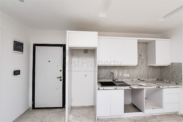 1+1 apartment in a new complex in Avsallar district