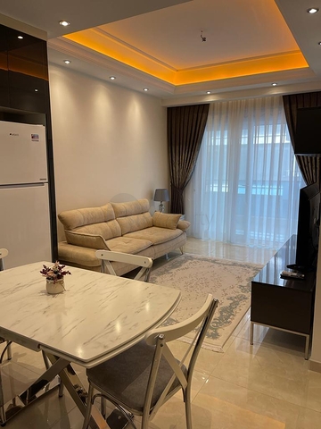 One-bedroom furnished apartment in a new complex in Mahmutlar