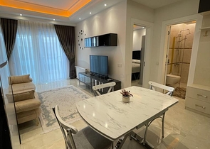 One-bedroom furnished apartment in a new complex in Mahmutlar