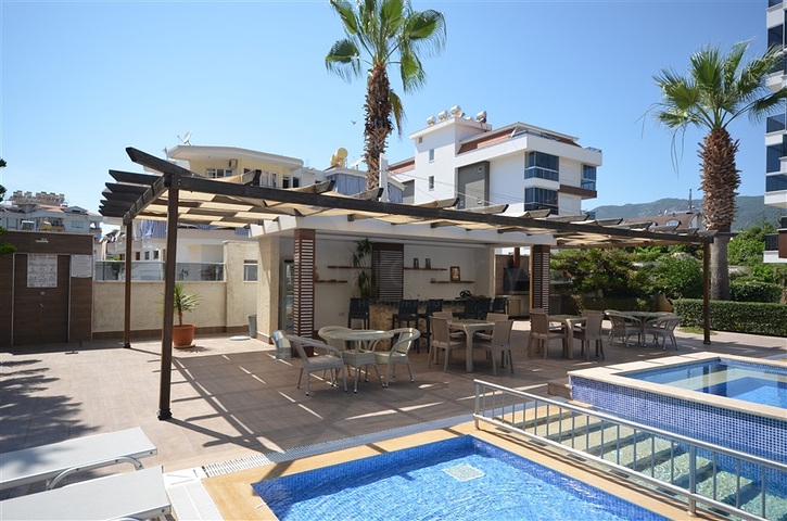 Spacious two-bedroom apartment with a beautiful view of the pool