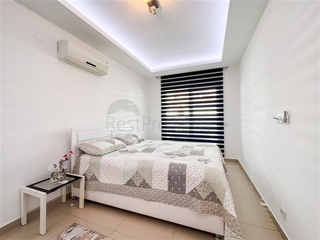 Spacious two-bedroom apartment with a beautiful view of the pool