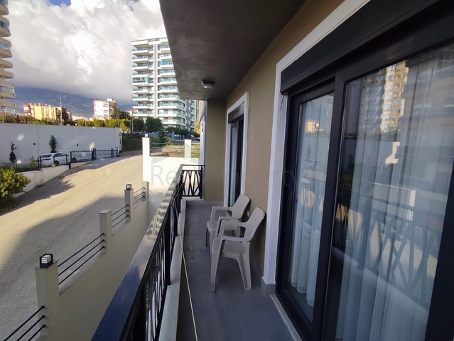 1+1 apartment with furniture and appliances in Mahmutlar district