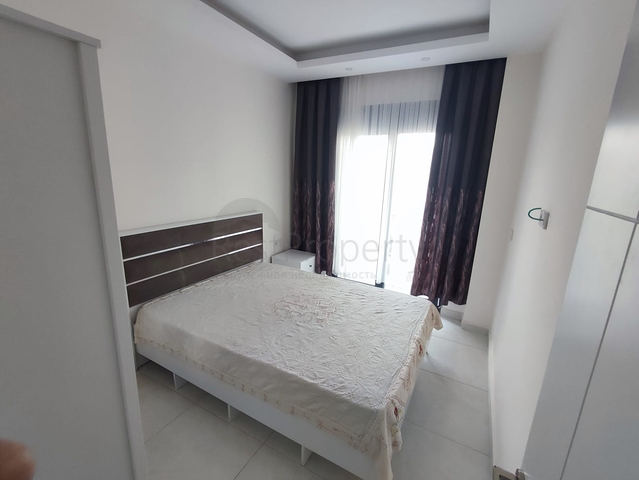 1+1 apartment with furniture and appliances in Mahmutlar district