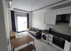 1+1 apartment with furniture and appliances in Mahmutlar district