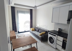 1+1 apartment with furniture and appliances in Mahmutlar district