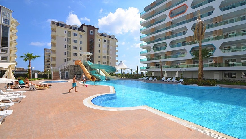 2+1 apartment in a complex with hotel infrastructure in Avsallar district