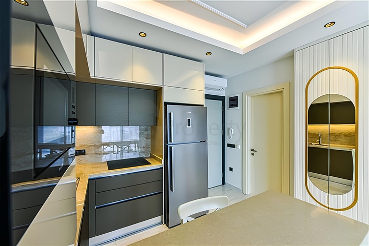 Beachfront 1+1 Apartment in Mahmutlar, Alanya – Private Beach Access