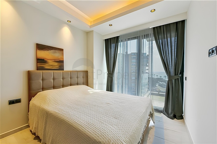 Beachfront 1+1 Apartment in Mahmutlar, Alanya – Private Beach Access