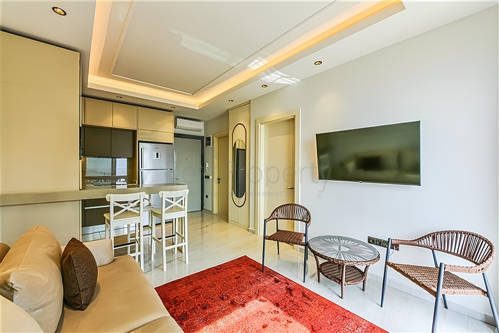 Beachfront 1+1 Apartment in Mahmutlar, Alanya – Private Beach Access