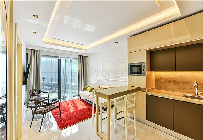 Beachfront 1+1 Apartment in Mahmutlar, Alanya – Private Beach Access