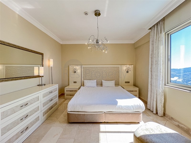 2+1 apartment in a house with hotel infrastructure in Kargicak district