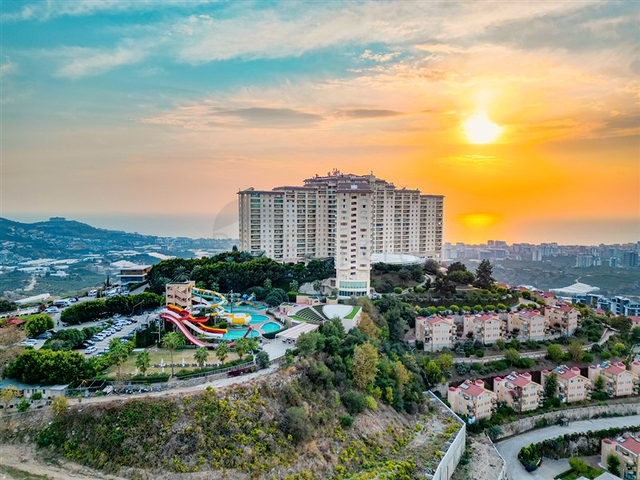 2+1 apartment in a house with hotel infrastructure in Kargicak district