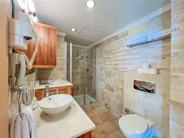 2+1 apartment in a house with hotel infrastructure in Kargicak district