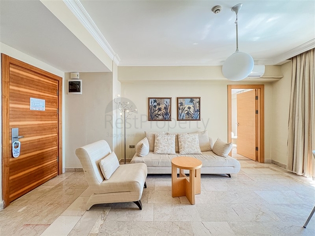 2+1 apartment in a house with hotel infrastructure in Kargicak district