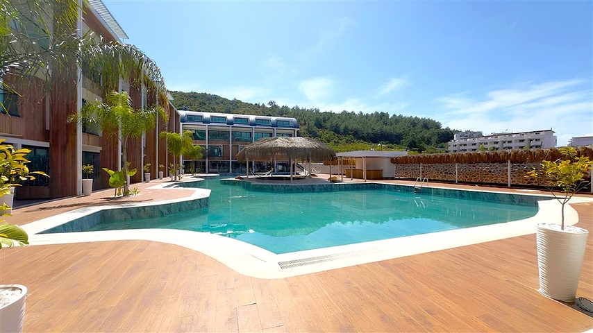 Modern duplex 2+1 with garden in a complex by the sea 