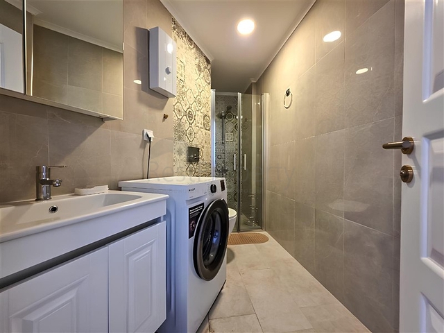 Rent a cozy 1+1 apartment with rich infrastructure in the heart of Mahmutlar