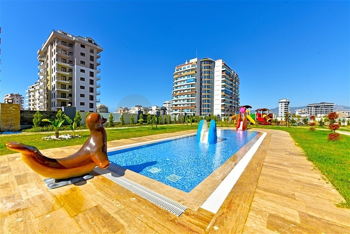 Rent a cozy 1+1 apartment with rich infrastructure in the heart of Mahmutlar