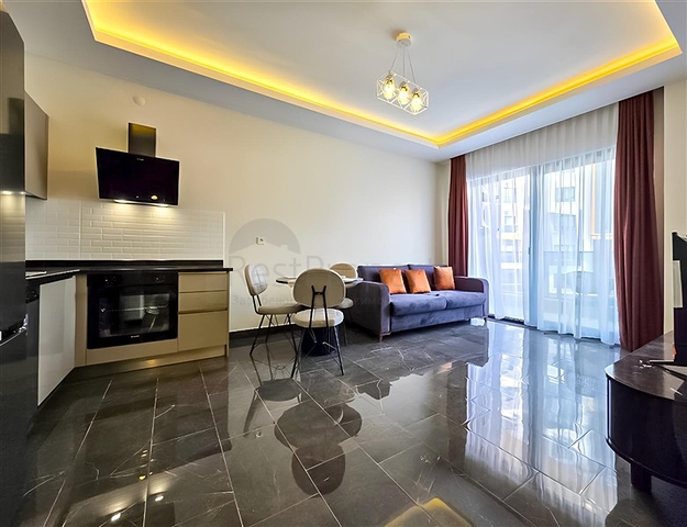 Rent a cozy 1+1 apartment with rich infrastructure in the heart of Mahmutlar