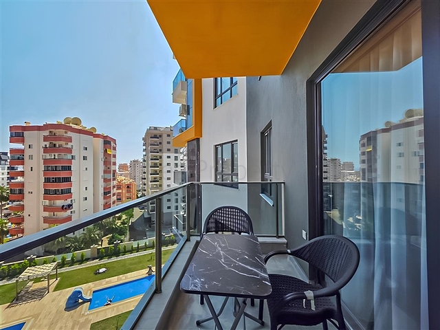 Rent a cozy 1+1 apartment with rich infrastructure in the heart of Mahmutlar