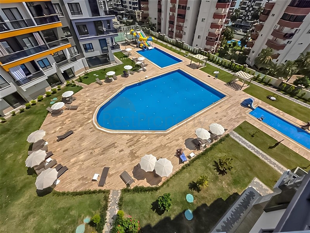Rent a cozy 1+1 apartment with rich infrastructure in the heart of Mahmutlar